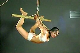 Sweet and horny Asian chick hogtied and swinging - free porn video